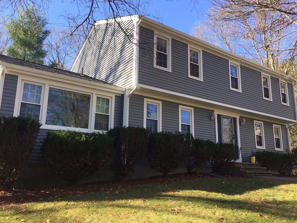 Gray Vinyl Siding and Window Installation on a Raised Ranch Home in MA