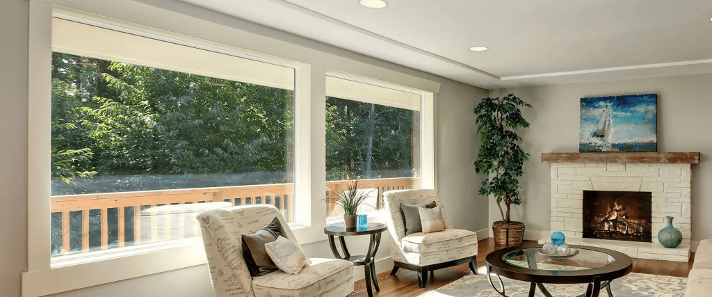 image_2024_11_25T21_02_43_551Z - Stronghouse a Living Room Showcasing a Fireplace and a Large Window Enhancing the Room's Brightness and Comfort