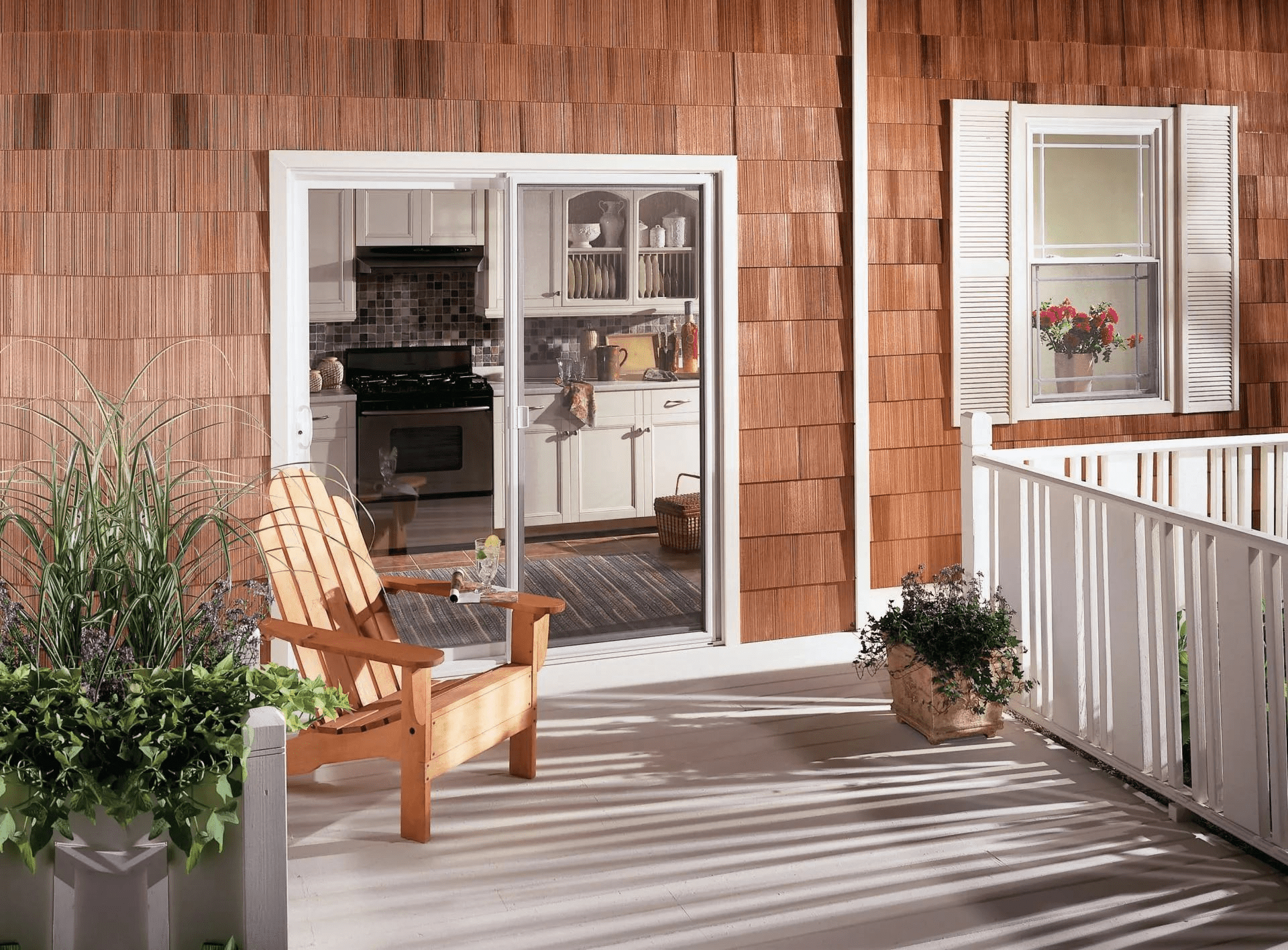 A wooden deck with a patio table and several chairs, creating a cozy outdoor dining space.
